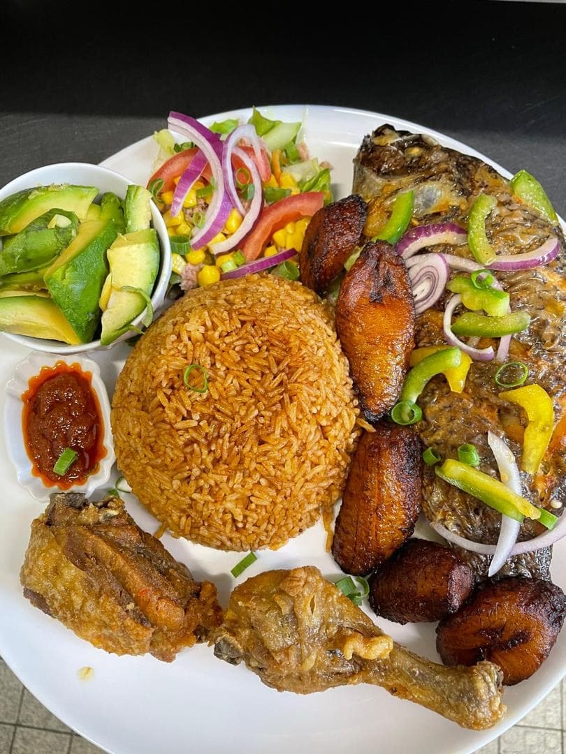 Jollof rice with grilled fish and chicken